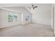 Spacious main bedroom with vaulted ceiling, ceiling fan, and large windows at 1835 Allegheny Dr, Gastonia, NC 28054