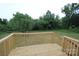 A newly built back deck overlooks a large grassy yard, perfect for outdoor activities and relaxation at 2002 Kingston Rd, Kingstown, NC 28150
