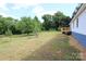 Spacious backyard featuring a wooden deck and ample green space at 2002 Kingston Rd, Kingstown, NC 28150