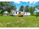 Spacious, green backyard with a wooden deck, perfect for outdoor entertaining at 2002 Kingston Rd, Kingstown, NC 28150
