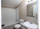 Bathroom features tub and shower combo and a modern white vanity at 2002 Kingston Rd, Kingstown, NC 28150