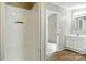 View of the bright bathroom with shower and vanity with modern sink and fixtures at 2002 Kingston Rd, Kingstown, NC 28150