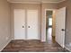 Bedroom features wood laminate floors, two closets and natural light at 2002 Kingston Rd, Kingstown, NC 28150