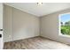 View of the bedroom with beautiful wood-look flooring and natural light from the window at 2002 Kingston Rd, Kingstown, NC 28150