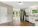 Bright dining area features an open floorplan and stainless appliances in the kitchen at 2002 Kingston Rd, Kingstown, NC 28150