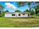 Well-maintained single story home with white exterior, red shutters, and easy ramp access at 2002 Kingston Rd, Kingstown, NC 28150