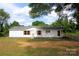 Charming single-story home with white siding, red shutters, and well-maintained front yard at 2002 Kingston Rd, Kingstown, NC 28150