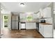 Charming kitchen features stainless appliances, white cabinets, and wood countertops at 2002 Kingston Rd, Kingstown, NC 28150