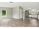 The spacious living room features wood floors and a view into the kitchen at 2002 Kingston Rd, Kingstown, NC 28150