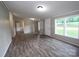 Bright living room featuring modern floors and large windows offering outdoor views at 2002 Kingston Rd, Kingstown, NC 28150