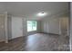 Spacious living room with neutral paint, vinyl flooring, and well-lit with recessed lighting and natural light at 2002 Kingston Rd, Kingstown, NC 28150