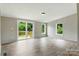 Spacious living room with a sliding glass door to the wood deck at 2002 Kingston Rd, Kingstown, NC 28150