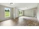 Bright, open living room with wood-look flooring and ample natural light at 2002 Kingston Rd, Kingstown, NC 28150