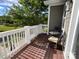 Relaxing outdoor balcony with comfortable seating and a view of the surrounding landscape at 2007 Bishops Ct, Cornelius, NC 28031