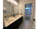 Stylish bathroom with dual sinks, modern fixtures, and mosaic tile accents at 2007 Bishops Ct, Cornelius, NC 28031