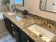 Luxurious bathroom featuring a double vanity with a granite countertop and modern fixtures at 2007 Bishops Ct, Cornelius, NC 28031