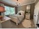 Comfortable bedroom featuring natural light and a large window at 2007 Bishops Ct, Cornelius, NC 28031