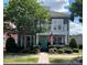 Charming two-story home with a balcony, landscaped yard, and inviting turquoise front door at 2007 Bishops Ct, Cornelius, NC 28031