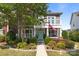Charming two-story home featuring a balcony, well-kept garden, and an inviting facade at 2007 Bishops Ct, Cornelius, NC 28031
