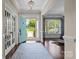 Elegant foyer with hardwood floors, a modern chandelier, and bright natural light at 2007 Bishops Ct, Cornelius, NC 28031