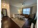 Relaxing living room features hardwood floors, plush seating, and a ceiling fan at 2007 Bishops Ct, Cornelius, NC 28031