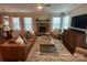 Bright living area boasts hardwood floors, ample seating, and a fireplace at 2007 Bishops Ct, Cornelius, NC 28031