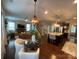 Open concept living and kitchen area with hardwood floors and plenty of natural light at 2007 Bishops Ct, Cornelius, NC 28031