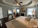 Beautiful main bedroom includes a fireplace, natural light, and hardwood floors at 2007 Bishops Ct, Cornelius, NC 28031