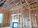 Interior framing of a new home construction with a fireplace and window at 2085 Bonds Ln # 26, Fort Mill, SC 29715
