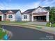 Street view of new construction homes with Tyvek wrap in a suburban neighborhood at 2085 Bonds Ln # 26, Fort Mill, SC 29715