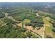 Expansive acreage with potential homesite surrounded by lush greenery, offering privacy and development possibilities at 21121 Shearer Rd, Davidson, NC 28036