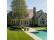 Luxury home featuring a private pool and lush landscaping at 21121 Shearer Rd, Davidson, NC 28036