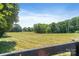 Open land featuring a scenic meadow surrounded by trees at 21121 Shearer Rd, Davidson, NC 28036