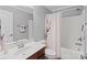 Well-lit bathroom with a shower and tub combo and a coordinated vanity at 2213 Normandin Ct, Charlotte, NC 28216
