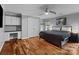 Comfortable bedroom featuring a ceiling fan, ensuite desk and bright natural light at 2213 Normandin Ct, Charlotte, NC 28216