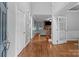 Inviting foyer featuring hardwood floors, high ceilings, and views into the spacious living area at 2213 Normandin Ct, Charlotte, NC 28216