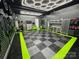 Well-organized garage with black and gray flooring, tool storage, and cabinets at 2213 Normandin Ct, Charlotte, NC 28216