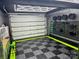 Spacious garage with custom lighting, tool storage, and epoxy flooring at 2213 Normandin Ct, Charlotte, NC 28216