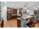 Open kitchen with granite countertops, stainless steel appliances, and breakfast bar seating at 2213 Normandin Ct, Charlotte, NC 28216