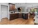 This kitchen features dark wood cabinetry, granite countertops, and stainless steel appliances at 2213 Normandin Ct, Charlotte, NC 28216