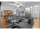 Open-concept living room with a large sectional sofa and seamless flow to the kitchen at 2213 Normandin Ct, Charlotte, NC 28216
