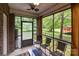 A screened patio featuring outdoor seating and views of the backyard at 2213 Normandin Ct, Charlotte, NC 28216