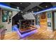 Finished basement features a bar, seating, and theater screen at 2213 Normandin Ct, Charlotte, NC 28216