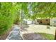 Backyard showing gravel walkway, greenery and grass at 244 River Clay Rd, Fort Mill, SC 29708