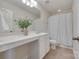 Clean, white bathroom features a single vanity and a shower-tub combination at 244 River Clay Rd, Fort Mill, SC 29708