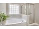 Bright and serene bathroom with soaking tub and separate glass shower at 244 River Clay Rd, Fort Mill, SC 29708