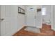 Bright foyer with hardwood floors, a mirror, and a view of the downstairs half bathroom at 244 River Clay Rd, Fort Mill, SC 29708