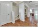 Spacious foyer featuring hardwood floors, stairs, an open floor plan, and natural light at 244 River Clay Rd, Fort Mill, SC 29708