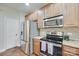 Well-lit kitchen features stainless steel appliances and granite countertops at 244 River Clay Rd, Fort Mill, SC 29708