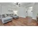 Cozy living room featuring hardwood floors, a comfy gray sectional, and soft, neutral walls at 244 River Clay Rd, Fort Mill, SC 29708